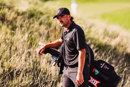 Tim Wiedemeyer walking with Golf Bag