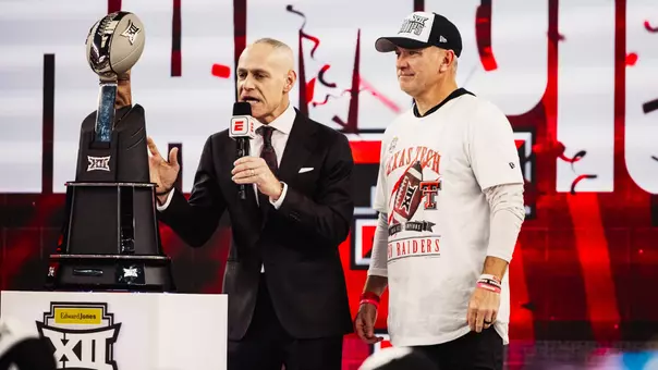 Big 12 Commissioner Brett Yormark speaks to the audience prior to presenting Texas Tech head coach Joey McGuire with the Big 12 Championship trophy.