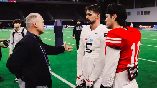 Texas Tech head coach Joey McGuire speaks to two of his former standouts in Cole Wisniewski (5) and Behren Morton (10) following practice for the East-West Shrine Bowl.