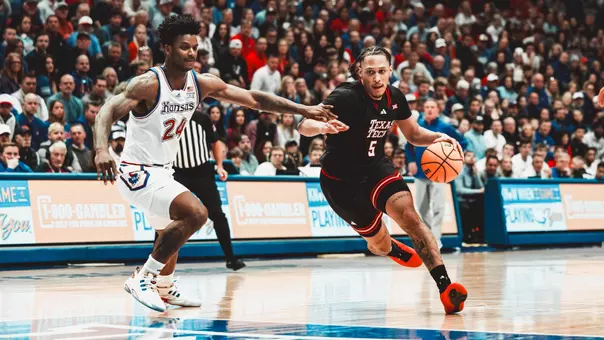 Darrion Williams drives to the basket in a win over Kansas at Allen Fieldhouse.