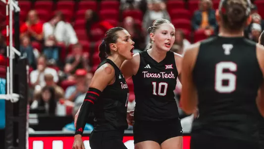 Tatum Johnson and Katelyn Cochran huddling up with the team after a point