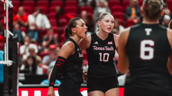 Tatum Johnson and Katelyn Cochran huddling up with the team after a point