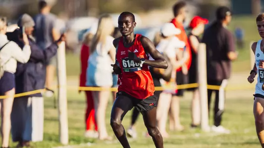 Titus Kimaru running at the Texas Tech Open cross country meet
