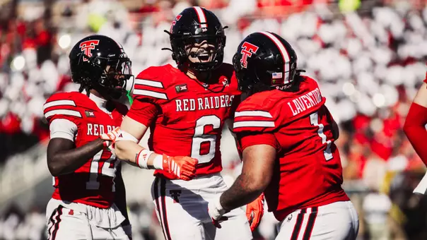 John Curry celebrates with Julien Laventure after his third interception of the season in Texas Tech's win over Arizona State.