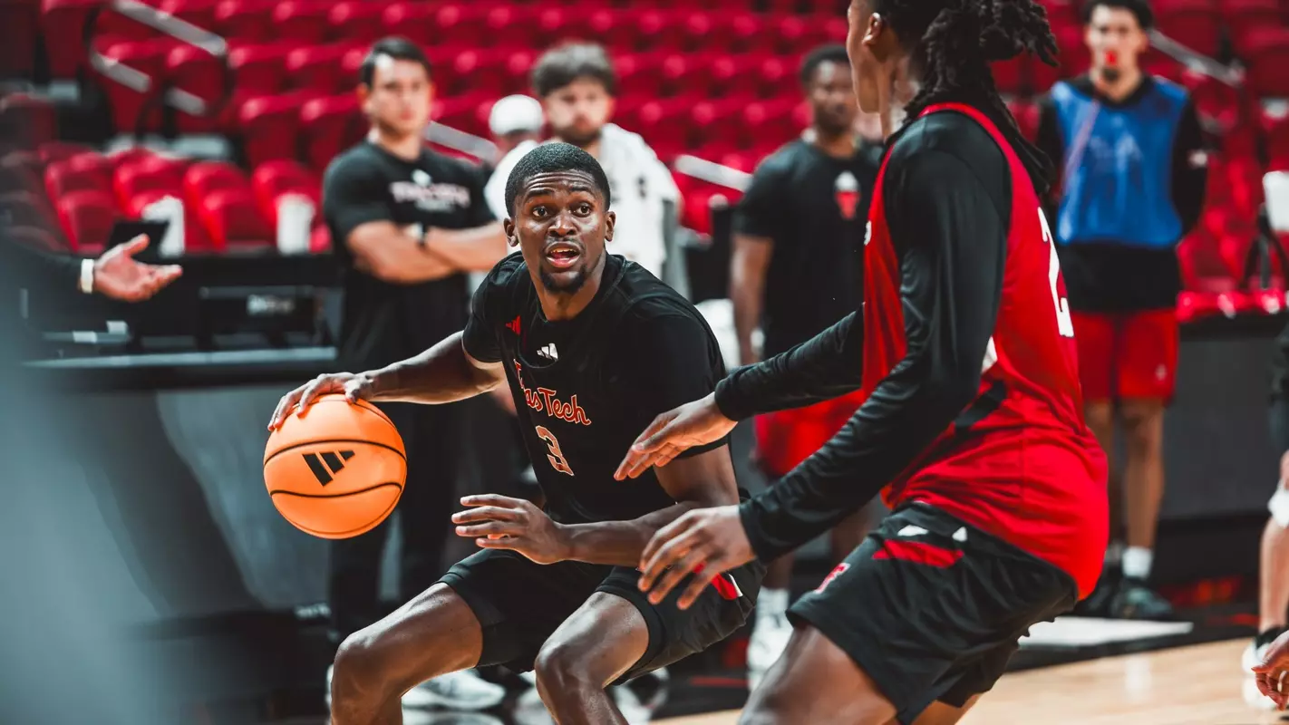 Cruz Davis looks for space to work during a Texas Tech basketball practice.
