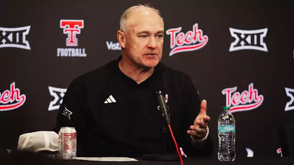 Joey McGuire speaks to a reporter during his postgame press conference following Texas Tech's win over Arizona State.