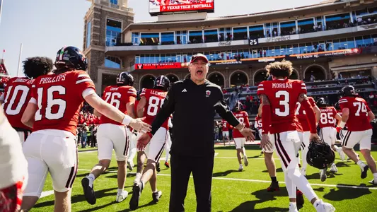 Joey McGuire fires up his players leaving the field prior to Texas Tech's victory over Arizona State.