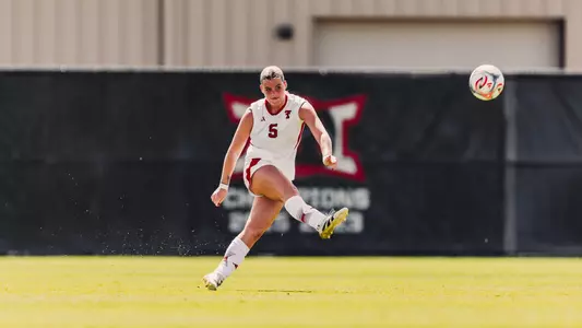 Eleanor Hays taking a shot on the soccer field off her right foot