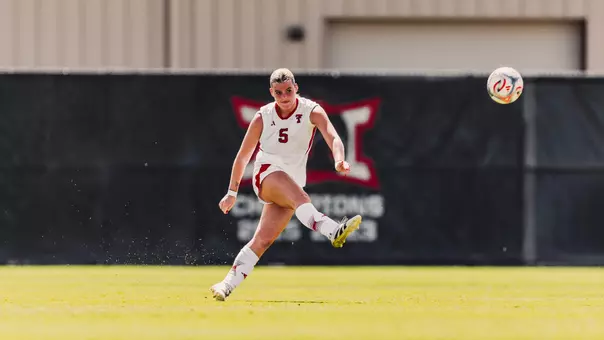 Eleanor Hays taking a shot on the soccer field off her right foot