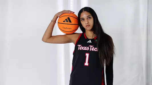 Jalynn Bristow poses with basketball at Lady Raider Content Day
