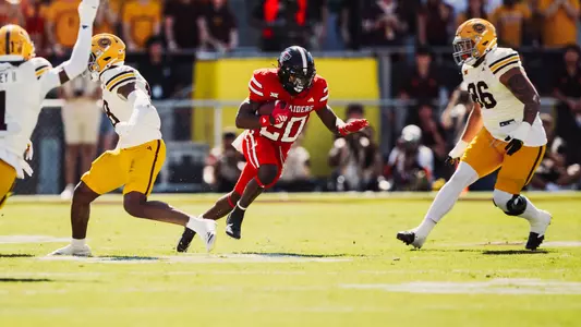 J'Koby Williams runs through the middle of several Arizona State players during Texas Tech's road loss to the Sun Devils in 2025.
