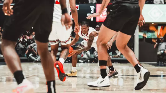 Jaylen Petty looks through the WVU defense with the ball in his hands surveying options for the Texas Tech offense.