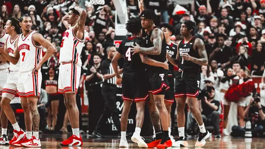 JT Toppin and Christian Anderson gather together in the lane after a basket against Houston.