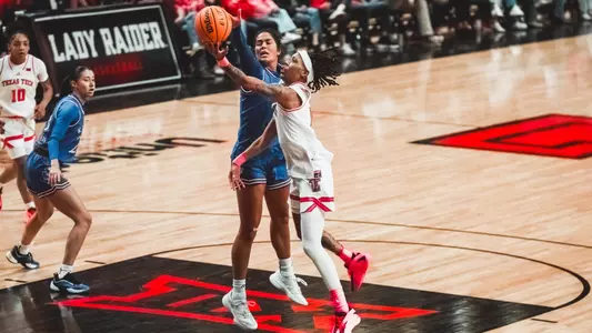 Snudda Collins trying to score on a contested layup.