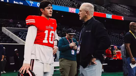 Texas Tech head coach Joey McGuire speaks to his former quarterback Behren Morton (10) following practice for the East-West Shrine Bowl.