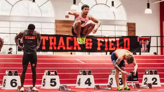Malachi Snow leaping in the air before the 60 meter sprint