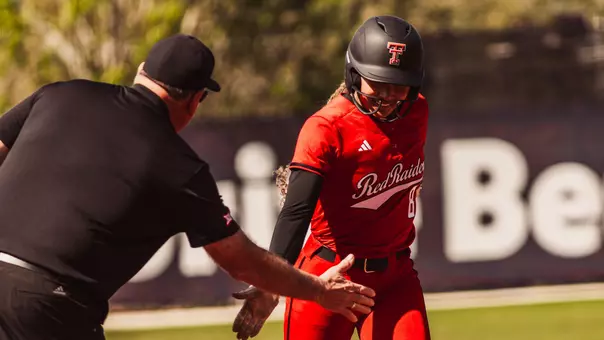 Desirae Spearman high fiving gerry glasco after a homerun