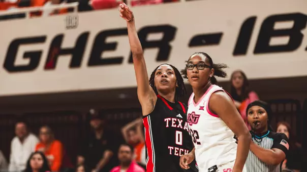 Snudda Collins following through on a three-point attempt.