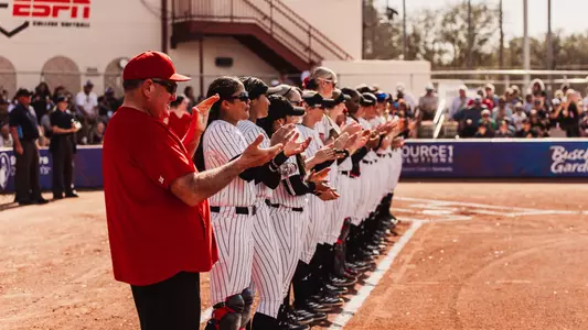 team in anthem line ahead of softball game