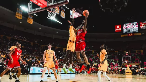 JT Toppin puts up a shot over an Arizona State defender.