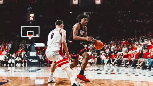 JT Toppin drives to the basket against No. 1 Arizona.