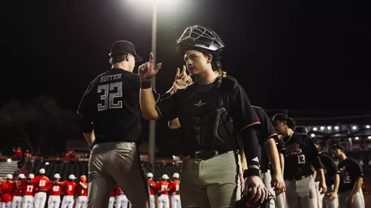 Texas Tech C Matt Quintanar puts his "Guns Up" to celebrate his Red Raiders 21-12 win over UTRGV.