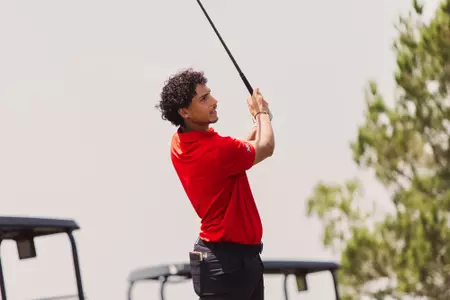 Adam Bresnu hits a practice shot at the Rawls Course