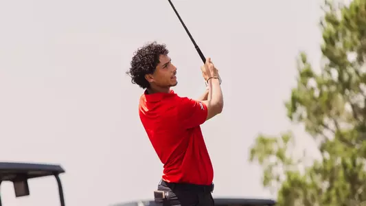 Adam Bresnu hits a practice shot at the Rawls Course