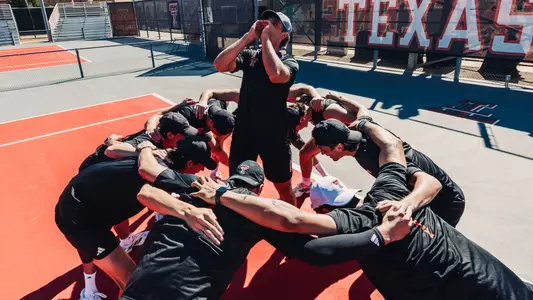 The team huddles before the match begins. Texas Tech Men's Tennis vs UNM on February 15, 2026 (Photo by Adele Clarke/Texas Tech Athletics)