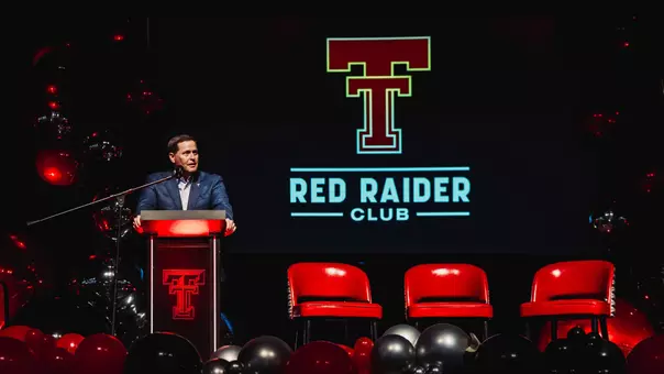 Texas Tech Director of Athletics Kirby Hocutt speaks to a crowded ballroom at the 2025 Red Raider Club Kickoff Luncheon.