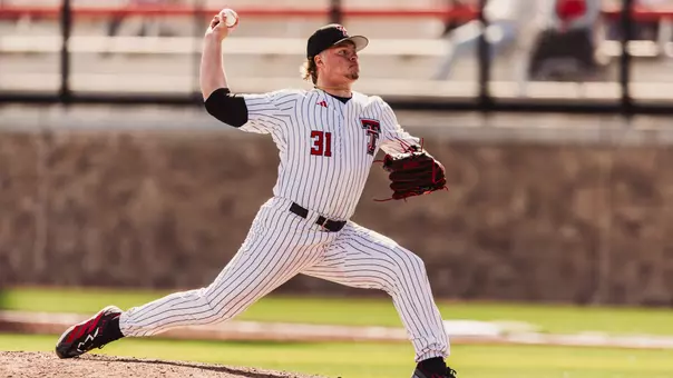 Wearing the Red Raiders Sunday pinstripes, righty hurler Kayson Raineri delivers a pitch during the Red Raiders sweep-clinching home win over UAlbany.
