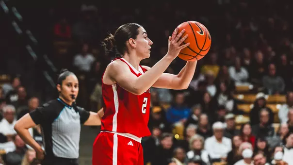 Gemma Nunez looking for a teammate to pass the ball to on an inbounds play.