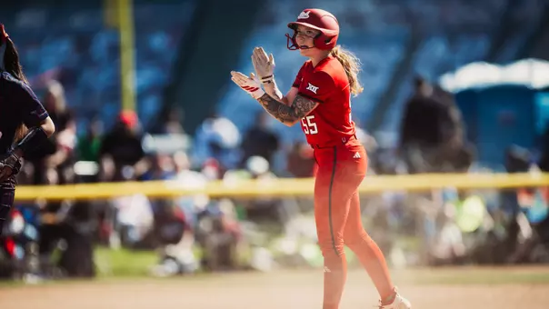 Kaitlyn Terry celebrating a hit against a team that texas tech softball is playing against