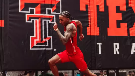 Johnathan Crawford coming off lane 6 in the 200 meter race