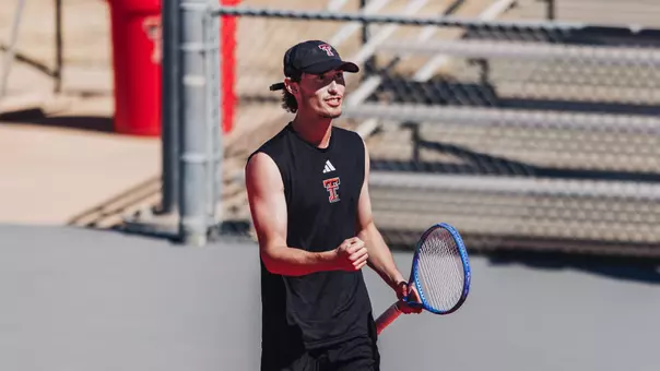 Joseph Patton celebrating a point in doubles.