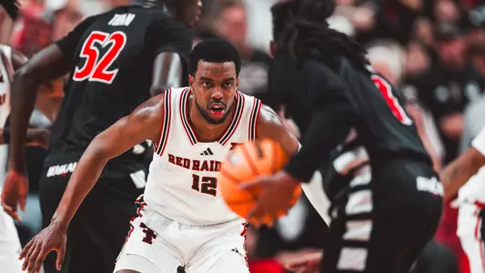 Donovan Atwell locks in on defense against a Cincinnati opponent.
