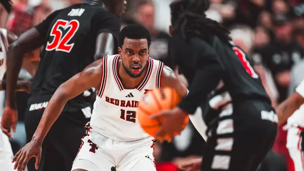 Donovan Atwell locks in on defense against a Cincinnati opponent.