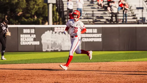 Hailey Toney rounding second after hitting a home run against ACU in softball