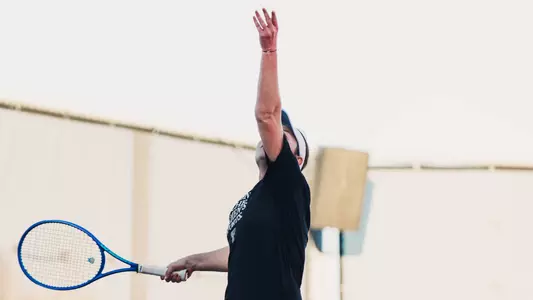 Andreea Lila throwing the ball up to serve. Texas Tech vs Sam Houston State Women's Tennis on February 1st, 2026 in Lubbock, TX. (Photo by Rane Paulson/Texas Tech Athletics)