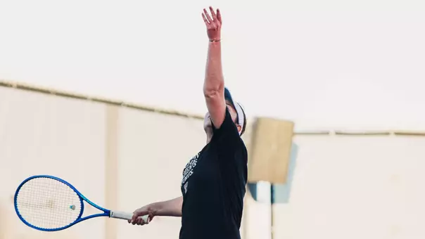 Andreea Lila throwing the ball up to serve. Texas Tech vs Sam Houston State Women's Tennis on February 1st, 2026 in Lubbock, TX. (Photo by Rane Paulson/Texas Tech Athletics)
