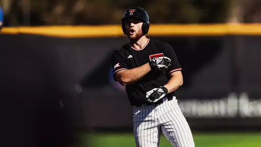 Texas Tech Junior Davis Rivers celebrates his two-RBI double, one of three extra-base hits the lefty had, Friday afternoon against CSU Bakersfield