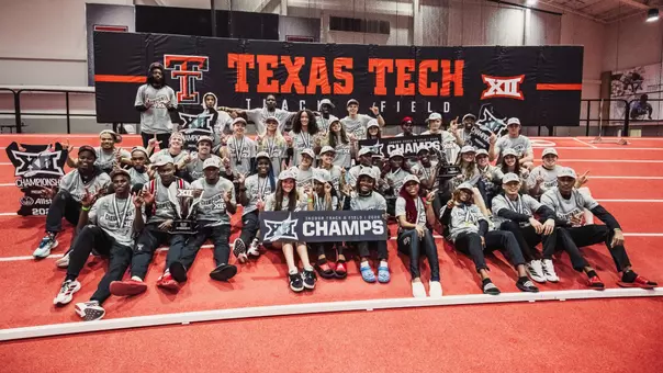 The Texas Tech men and women indoor track and field teams take a group photo after winning the Big 12 indoor meet