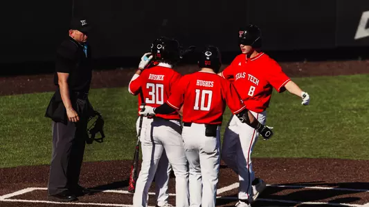 Texas Tech 3B Connor Shouse celebrates with his teammates following his three run fifth-inning home run Saturday afternoon