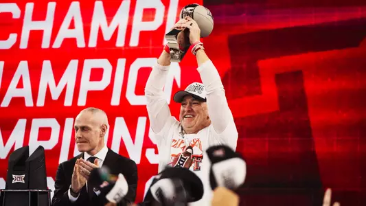 Texas Tech head coach Joey McGuire raises the Big 12 Championship trophy after defeating BYU this past December.