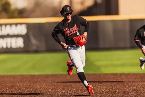 Texas Tech Freshman Linkin Garcia wearing the 'Black Gladiator' uniform fields a ball at shortstop during the 2026 Alumni Game.