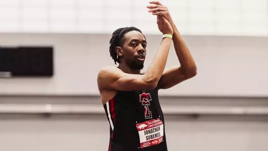 Jonathan Seremes clapping his hands before a huge jump at the Razorback Invitational where outside it was 5 degrees but inside it was a controlled temperature of 72 degrees