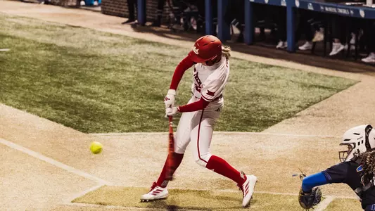 Hailey Toney swinging her bat to connect on a home run against McNeese State in Texas Tech softball's 13-3 win in five innings on opening day of the 2026 season