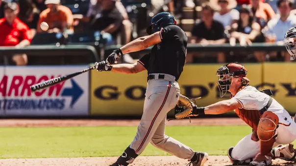 Texas Tech Grad Student Robin Villeneuve takes a swing during an at-bat in the Red Raiders fall contest against Texas in Round Rock.