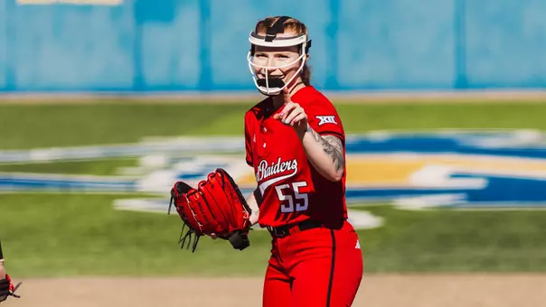 Kaitlyn Terry in a red Texas Tech uniform pitching