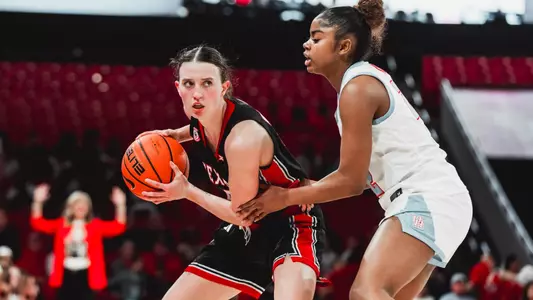 Bailey Maupin holding the ball with an intense look on her face.